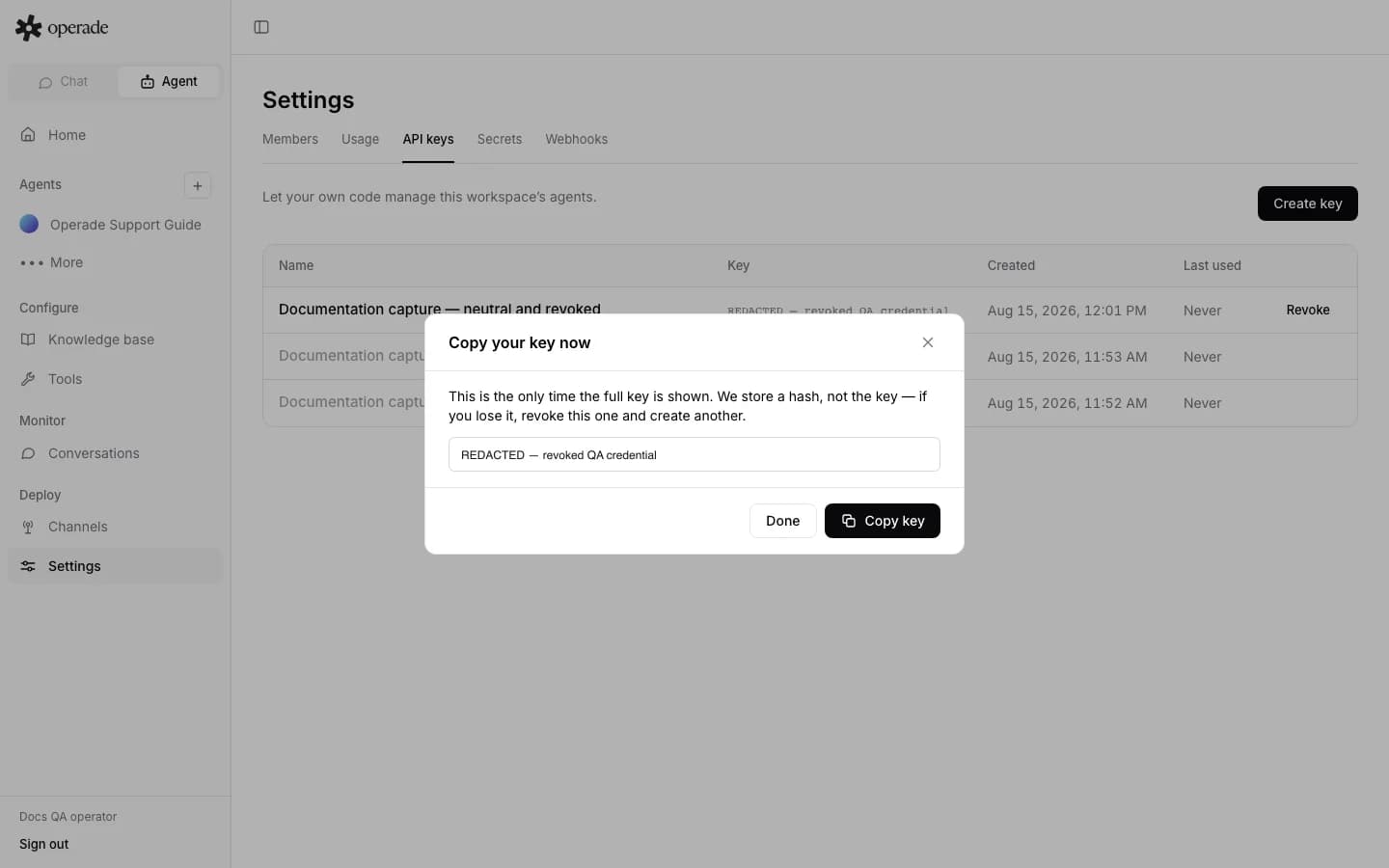 One-time API key dialog with the credential visibly redacted before revocation